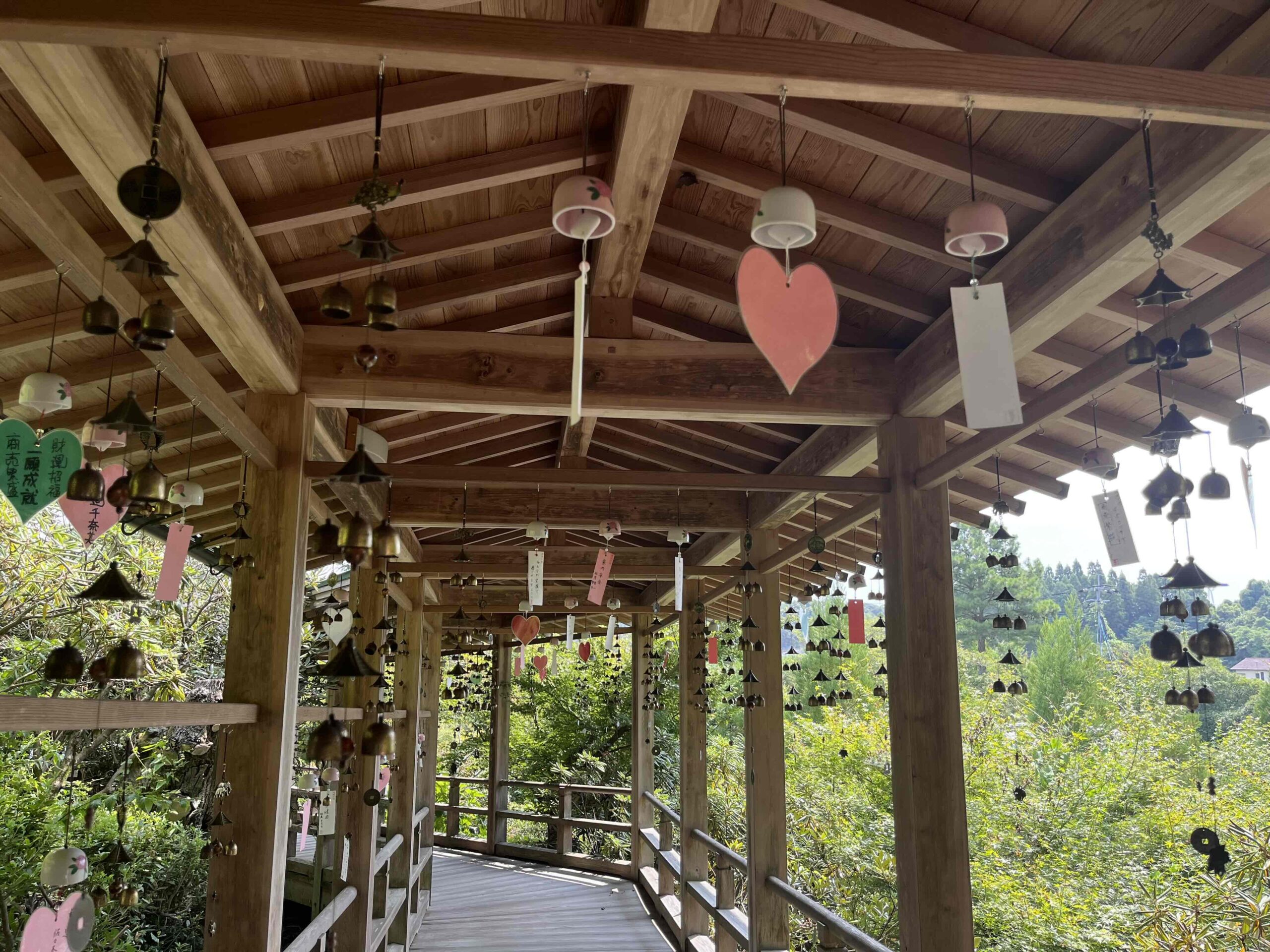 Wind chimes hanging along the covered walkway at Kouyaji in Takeo